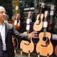 Illustration for article titled Daring To Dream: Jeff Bezos Is Standing Outside A Guitar Center Gazing Longingly At A $200 Billion Guitar